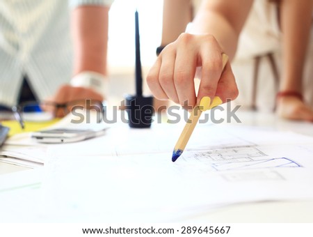 Young female engineer working in office