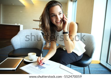 Similar – Image, Stock Photo Young attractive woman sitting at home in coxy chair drinking white wine. Treat yourself after hard day at work. Tasting wine. Yellow color in home interior. Casual everyday millennial lifestyle.