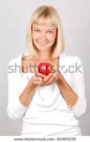 Nutritional value/ Beautiful Young Woman holding an apple