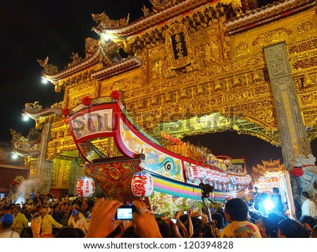 OCTOBER 20: The Burning King Boat Ceremony in DongGang, Taiwan on October 20, 2012. The believers move the King Boat around the downtown of Donggang.