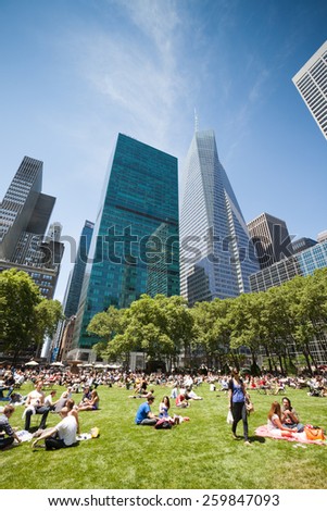 NEW YORK - JUNE 03: People gather in a New York park to enjoy a summer day, in New York, United Stated on June 03, 2011