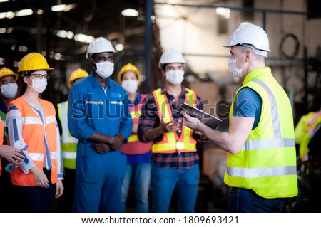 The manager leader team is assignmenting job, training for technicians, supervisor, engineers In the morning meeting before work which everyone wear masks to prevent the coronavirus and safety working