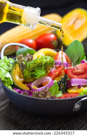Olive oil and  fresh vegetable salad