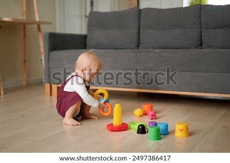 Similar – Image, Stock Photo baby playing on the floor II