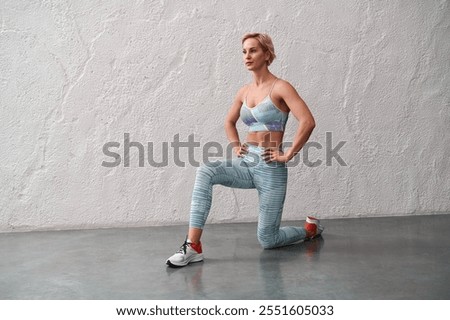 Similar – Image, Stock Photo Focused young sportswoman doing exercise with weight at home