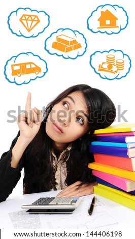 Beautiful businesswoman thinking with a calculator, a pen, and a pile of books - isolated on white background