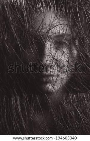portrait face girl through net in monochrome