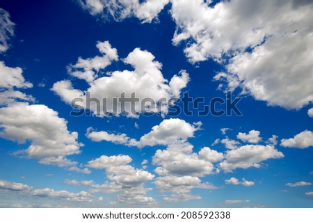 Cloudscape with cumulus clouds and blue sky