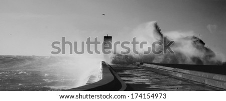 lighthouse and broken wave in black and white version