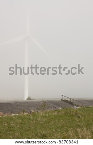 wind mill power station in fog