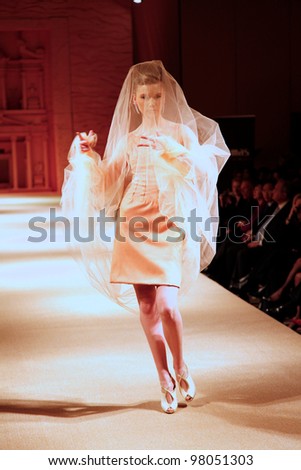 AMMAN, JORDAN - APRIL  12:  model wears clothes made by Italian designer of Palestinian descent Jamal Taslaq during a fundraiser fashion show for a local charity on April 12, 2010 in Amman, Jordan.