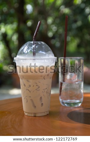 ice coffee and water pouring .
