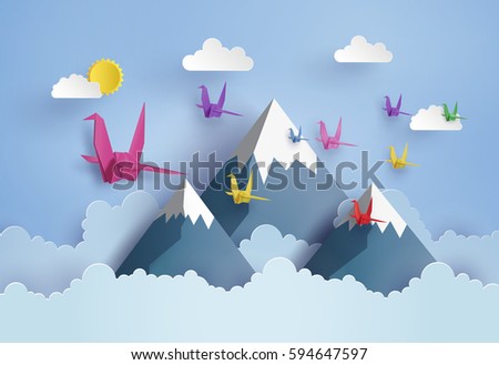origami made colorful paper bird flying on blue sky over moutian with cloud . paper art and craft style.