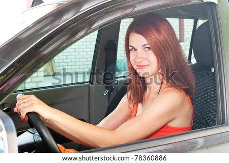 Beautiful Sexy Young Woman With Red Hair Is Driving A Car Stock Photo ...