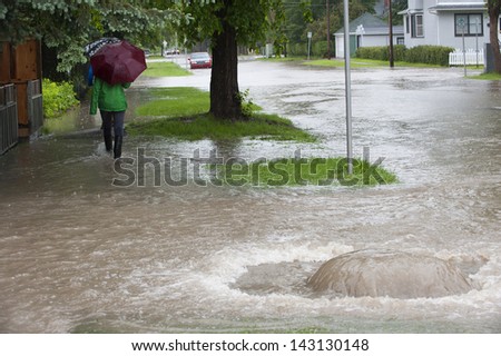 Community Residents Exploring the Flooded Streets of Their  Community