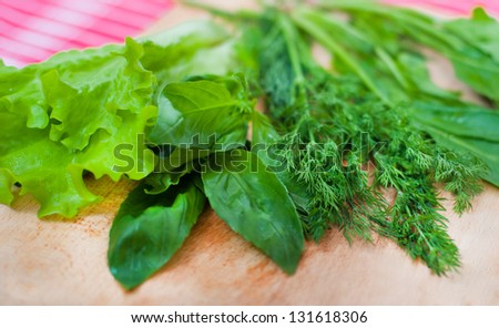 Fresh herbs on wooden texture