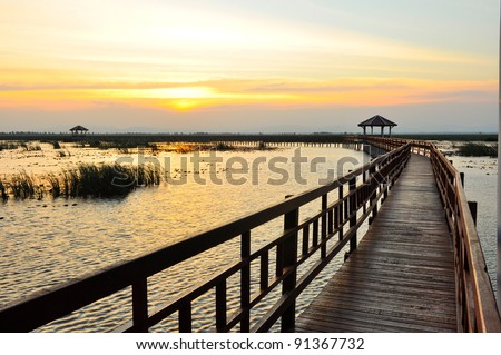 Boardwalk on the lake at sunset, Sam Roi Yod National Park, Prachuap Khiri Khan, Thailand