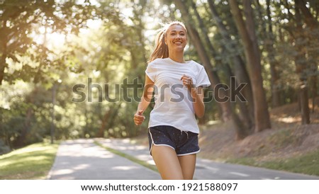 Similar – Image, Stock Photo Smiling woman dressed sportswear with rolled pilates mat in a park