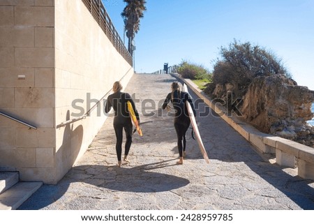 Image, Stock Photo Anonymous female surfer walking on beach with surfboard