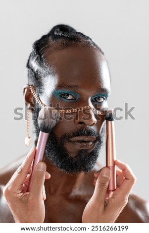 Similar – Image, Stock Photo Bearded man applying makeup on eyes