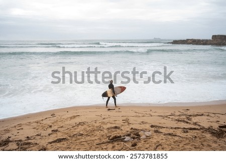 Image, Stock Photo Anonymous surfer at the beach with surfboard