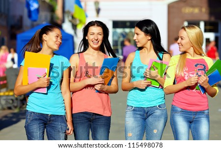 four beautiful college girls walking on the street