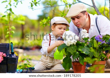 family cares for plants in spring garden