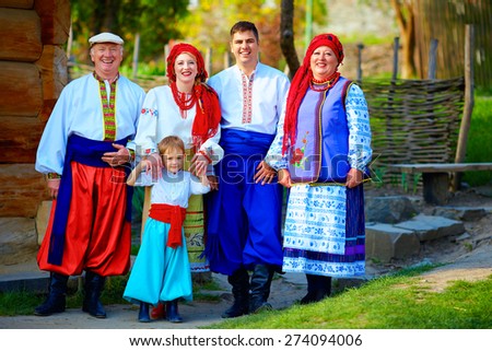 portrait of happy ukrainian family in traditional costumes