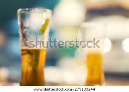 blurred image of cool drinks in cafe with bokeh background, cold bear, colorful defocused background