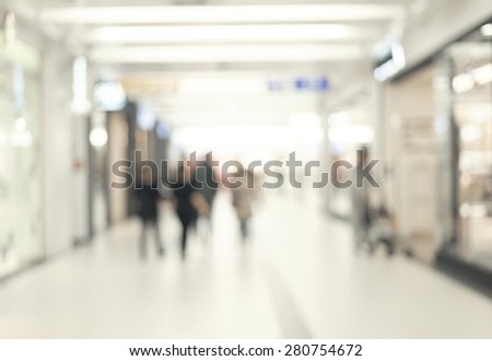 blur abstract people background, unrecognizable silhouettes of people walking in shopping mall