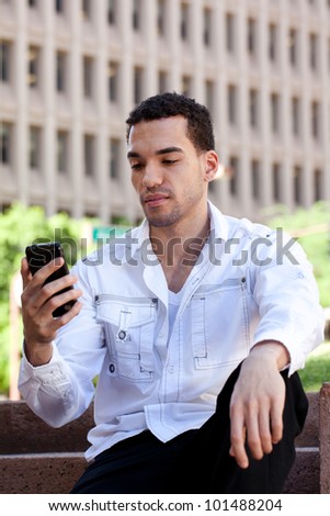 Good Looking Guy in his twenties Texting
