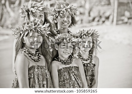 Hula girls on the beach in Black and white textured grain photo for aging effect