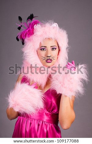 Young woman in cat costume and Fuchsia dress