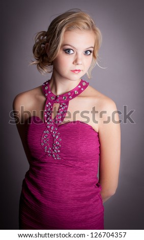 Young Beautiful Elegant Lady in Fuchsia colored evening gown