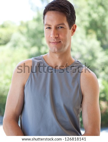Good looking guy in tank top and jeans
