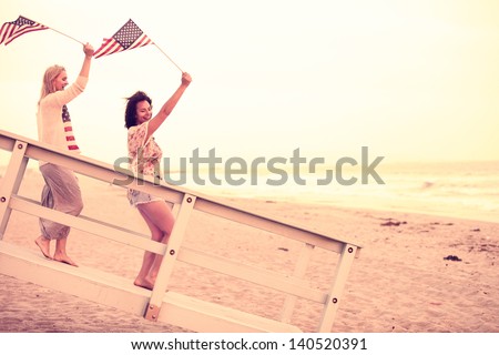 Woman on the Beach at sunset with USA flags American youth concepts