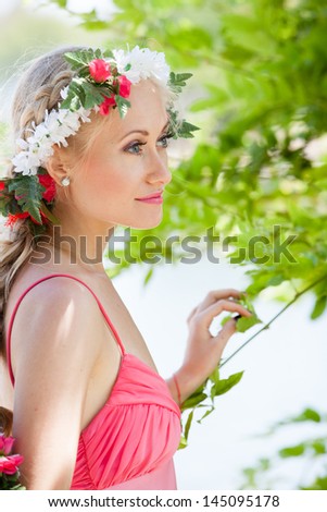 Beautiful Young Woman as if to be Mother Nature looking out in thought