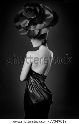 black and white portrait of a girl in a dark roses suit