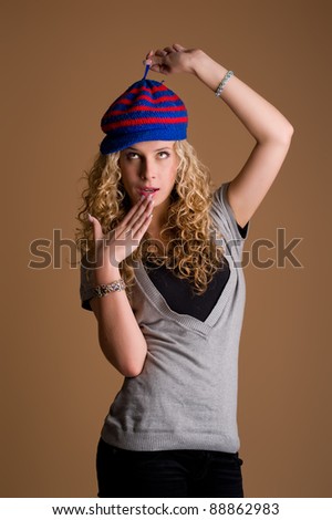 young woman looking in wide-eyed astonishment. studio shot