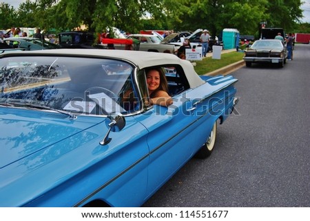 FREDERICK, MD- SEPTEMBER 16: Unidentified Woman drives a 1960 Blue Pontiac Catalina on September 16, 2012 in Frederick , MD USA. Alzheimer\'s Association Car Show at VA in Maryland.