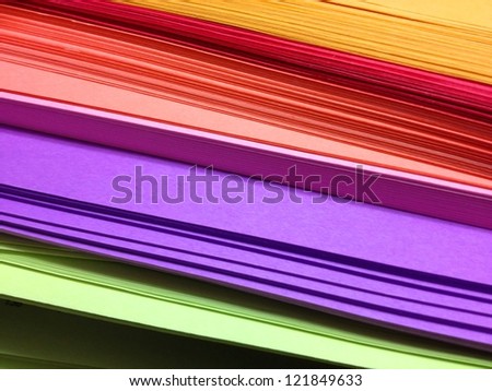 Assorted Colored Pile of Papers on Black Background