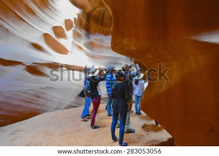 PAGE, AZ - MAY 26: Upper Antelope Canyon tour on May 26, 2015 in Page AZ,USA. Thousands of people from all over the world come to visit Upper Antelope Canyon