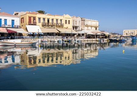 RETHYMNO, GREECE - SEPTEMBER 13. Taverns and Fishing boats in the harbor of Rethymno on September 13, 2014. Rethymno is nice city with a wonderful old city part and venetian port located on Crete