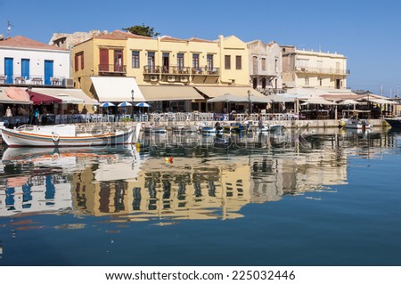RETHYMNO, GREECE - SEPTEMBER 13. Taverns and Fishing boats in the harbor of Rethymno on September 13, 2014. Rethymno is nice city with a wonderful old city part and venetian port located on Crete