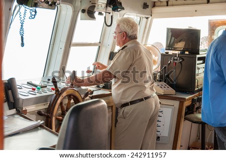 PALEOCHORA, CRETE, GREECE - SEPTEMBER 22, Nautical bridge on the ferry to Agia Roumeli and to the island Gavdos on September 22, 2014. The Captain is on the bridge