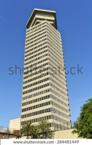 BARCELONA, SPAIN - MAY 31.The Columbus building has 110 meters and 28 floors. It was the first skyscraper above 100 meters in Barcelona  Window cleaners are roped up on the building on May 31, 2012