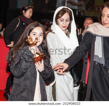 BERLIN, GERMANY - FEBRUARY 14, 2015: Solmaz Panahi with the golden bear for \'Taxi\' during the Closing Ceremony of the 65th Berlinale International Film Festival at Berlinale Palace