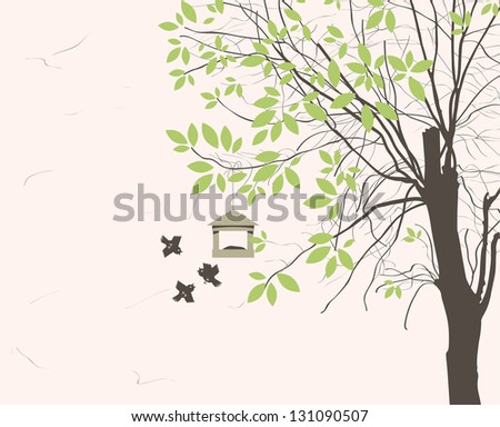 spring landscape with tree young leaves and bird feeders