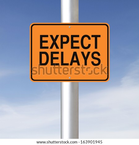 A road sign warning of delays ahead