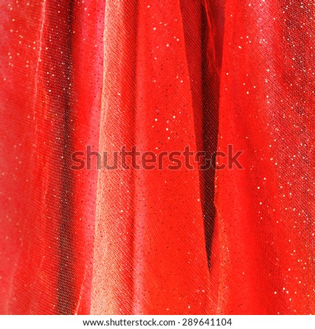 Background from red delicate fabric with sequin
